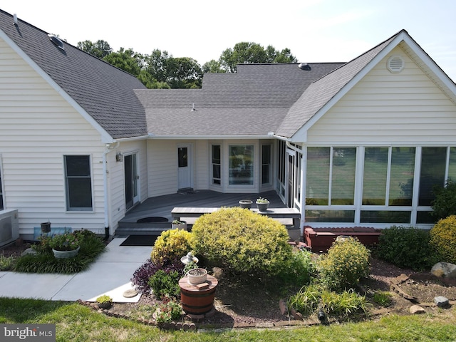 back of house with a sunroom