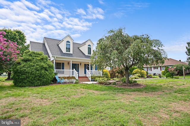 cape cod house with a porch and a front yard