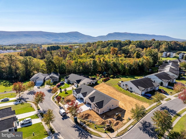 birds eye view of property with a mountain view