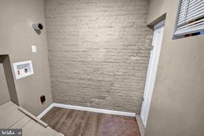 laundry room featuring wood-type flooring and hookup for a washing machine