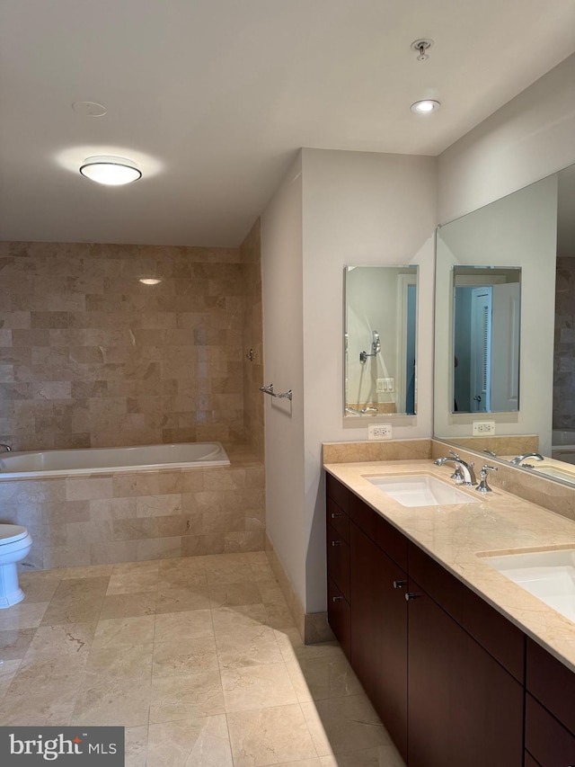 bathroom with a relaxing tiled tub and vanity