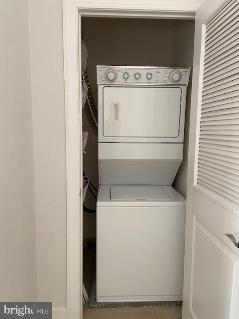 spacious closet featuring light colored carpet