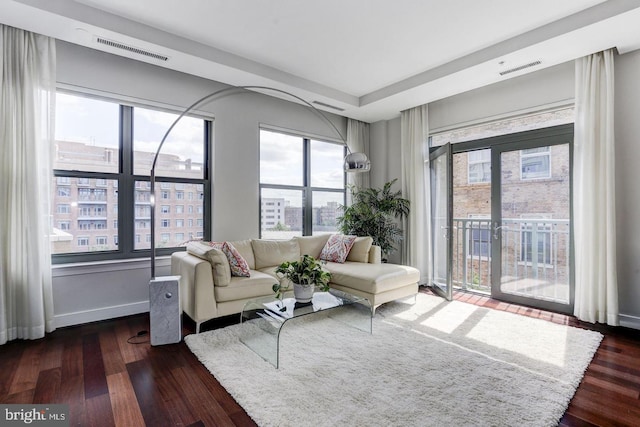 living room with dark hardwood / wood-style flooring