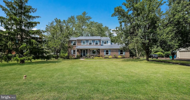 colonial home with a front yard