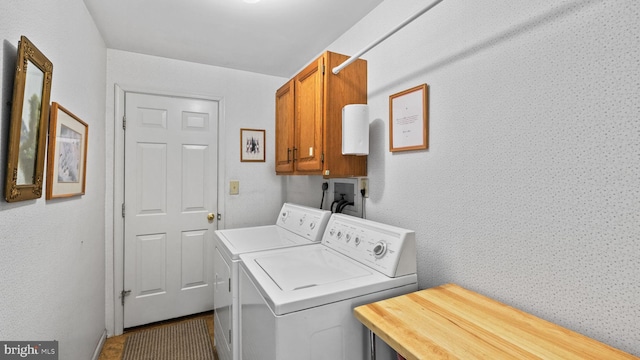 washroom with washing machine and dryer, cabinets, and tile patterned floors