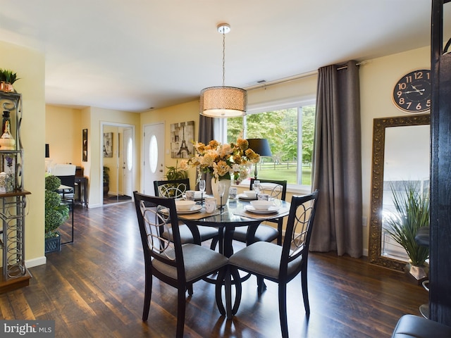 dining space featuring dark hardwood / wood-style floors