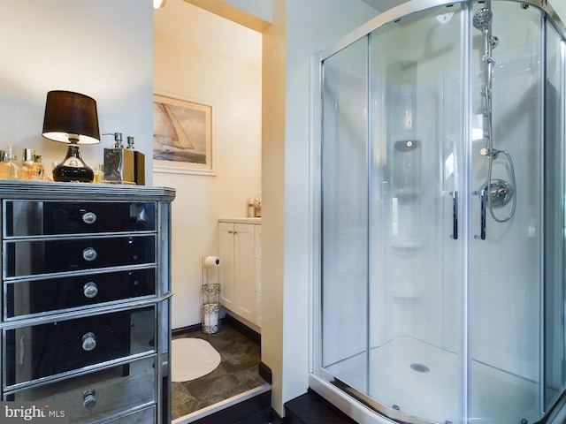 bathroom featuring vanity and an enclosed shower