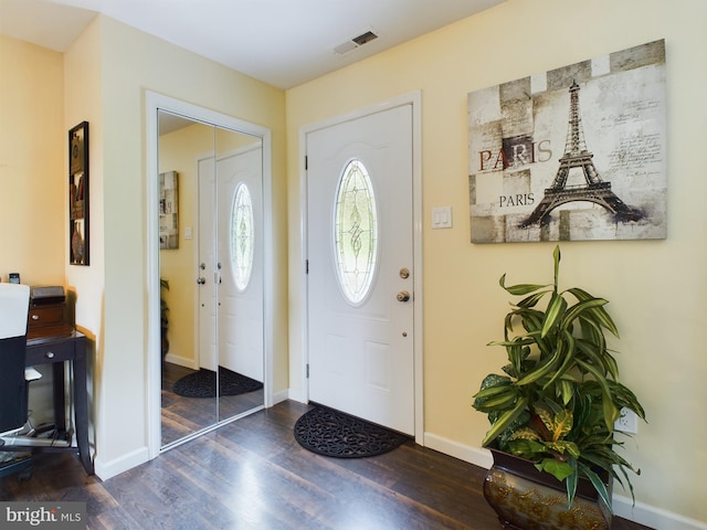 foyer with dark hardwood / wood-style floors