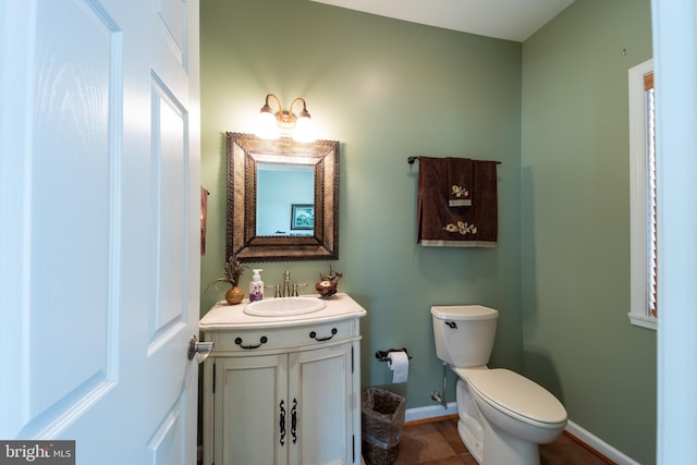 bathroom with tile patterned flooring, vanity, and toilet