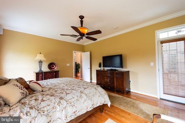 bedroom with ceiling fan, crown molding, and hardwood / wood-style floors