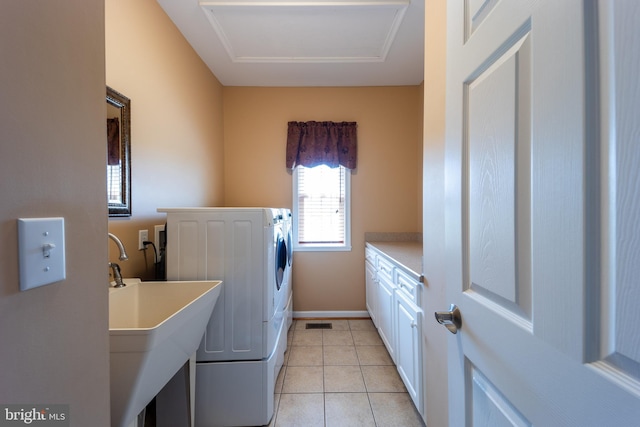 laundry room with sink and light tile patterned floors