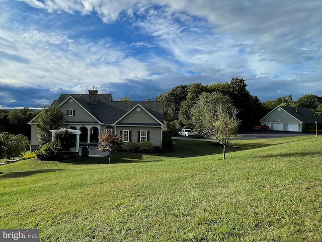 rear view of property featuring a lawn