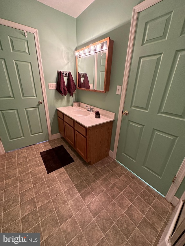 bathroom featuring tile patterned floors and vanity