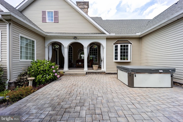 view of patio / terrace featuring a hot tub