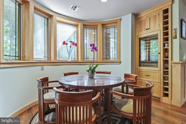 dining area with wood-type flooring