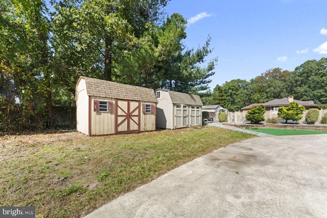 view of outbuilding with a lawn