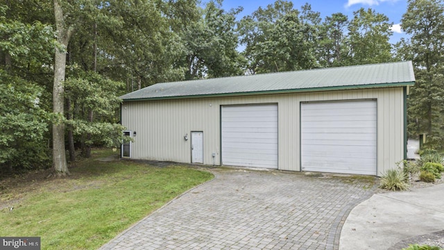 garage with a yard