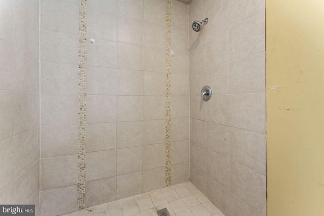 bathroom with tiled shower