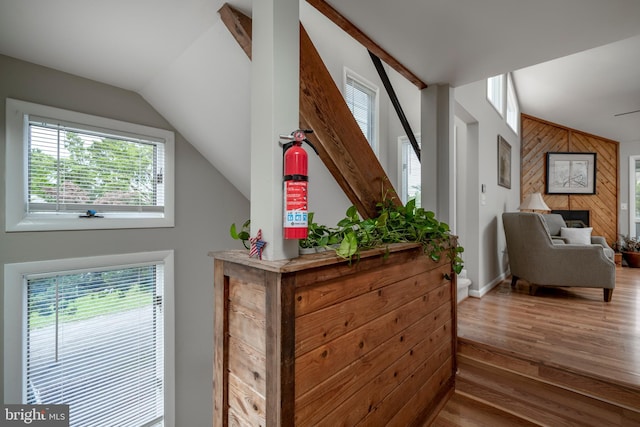 interior space featuring wooden walls and hardwood / wood-style floors