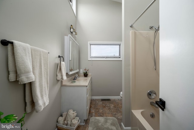 full bathroom featuring  shower combination, vanity, and toilet