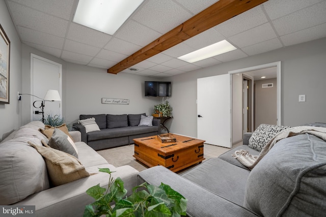 living room with a paneled ceiling