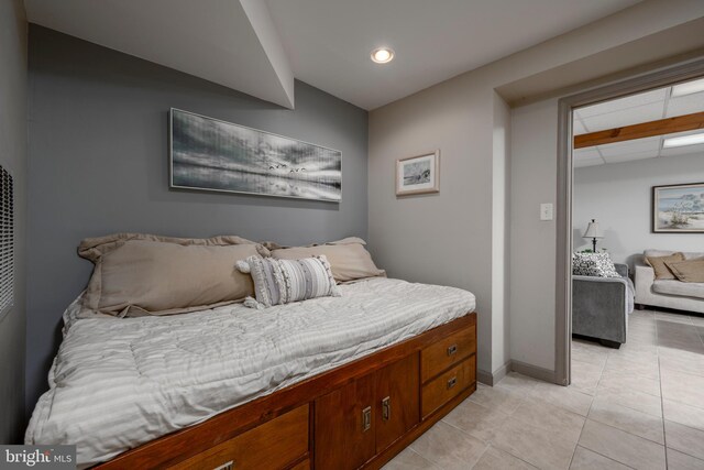 bedroom featuring light tile patterned flooring