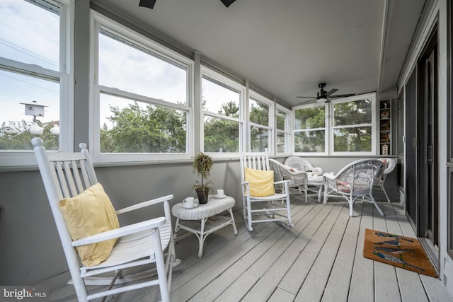 sunroom with plenty of natural light and ceiling fan