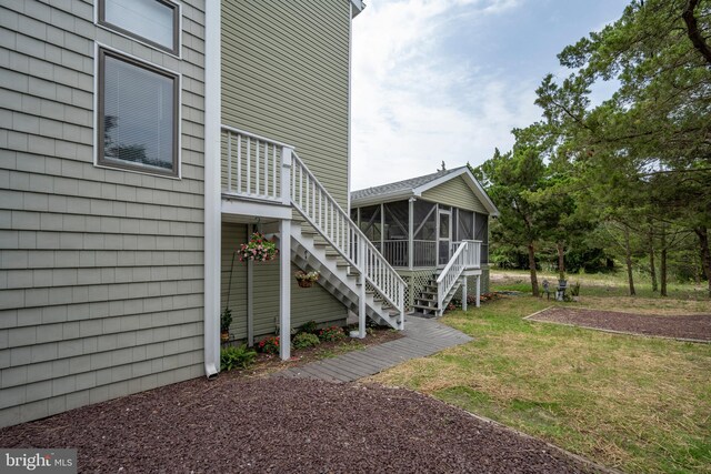 view of yard with a sunroom