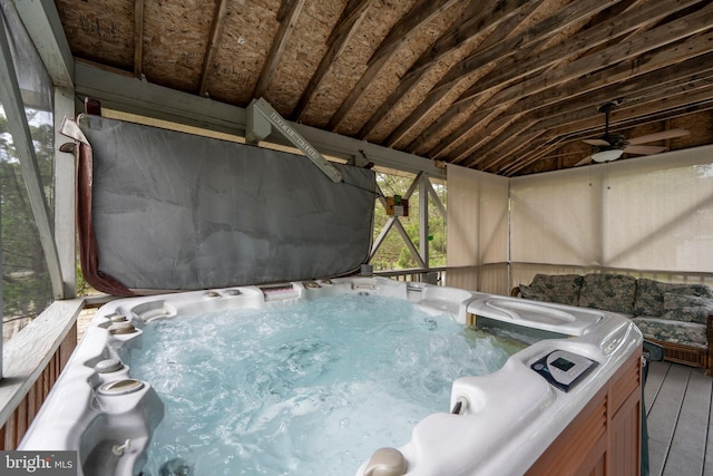 view of swimming pool with a hot tub and ceiling fan