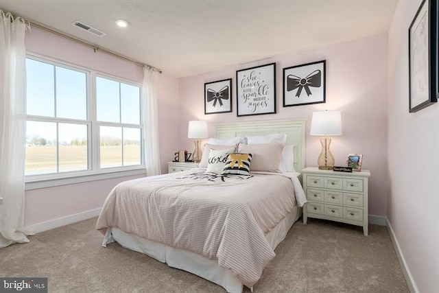 bedroom featuring light colored carpet