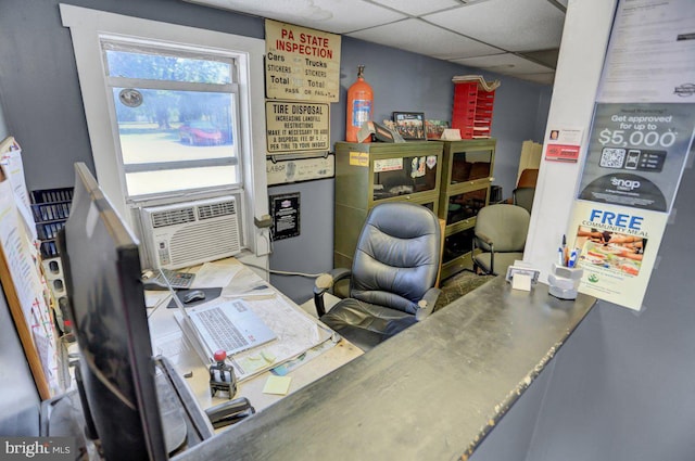 office space featuring cooling unit and a drop ceiling