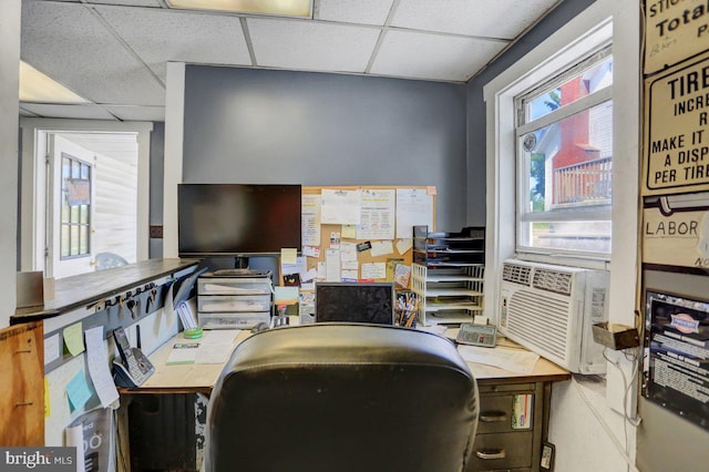 home office with a drop ceiling and cooling unit