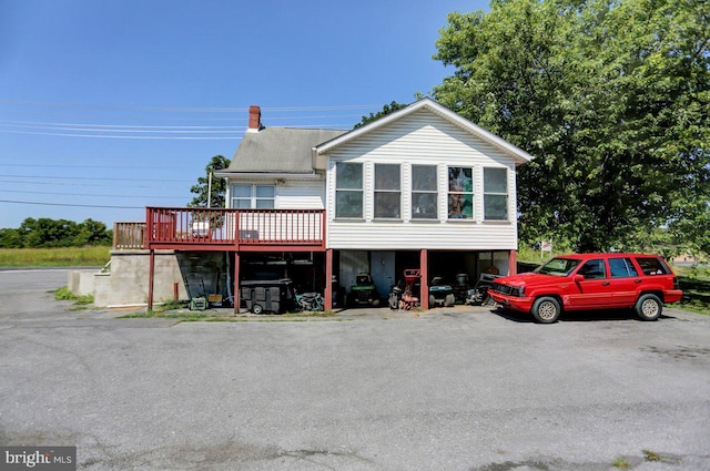 view of front of property with a wooden deck