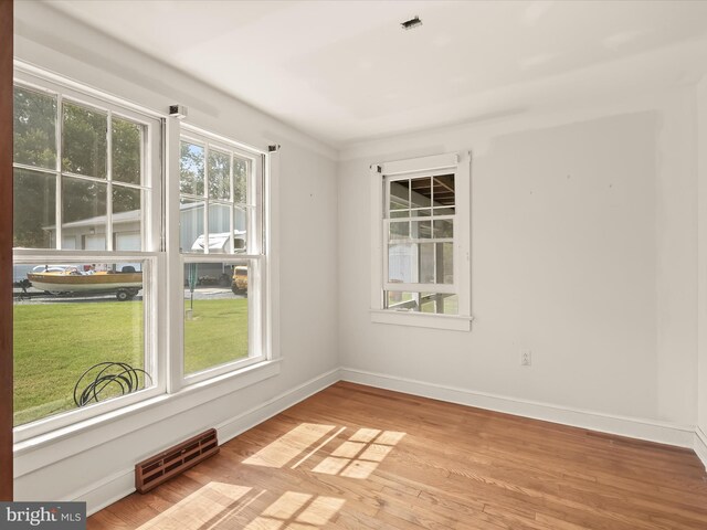 unfurnished room featuring light wood-type flooring