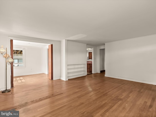 spare room with hardwood / wood-style flooring