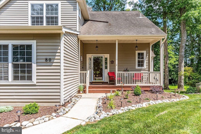 view of front of home featuring a front lawn and a porch