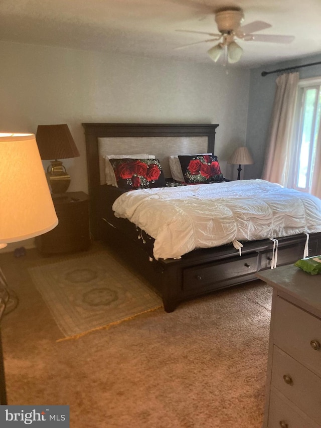 carpeted bedroom with ceiling fan