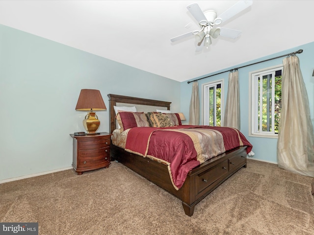 bedroom with light carpet and ceiling fan