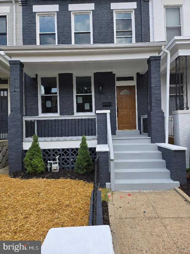 doorway to property with a porch