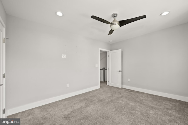 unfurnished bedroom with light carpet and ceiling fan