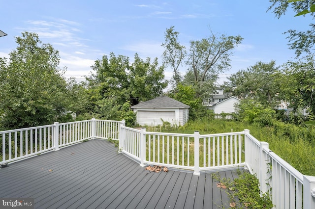 wooden terrace with an outbuilding