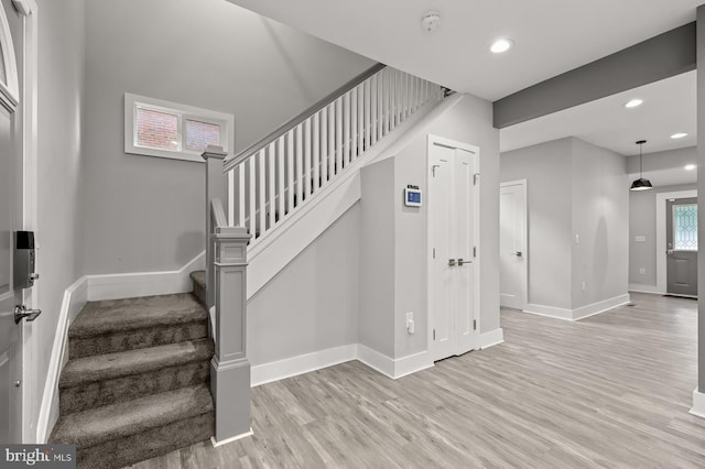 staircase featuring wood-type flooring