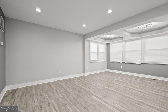 unfurnished room featuring light hardwood / wood-style floors