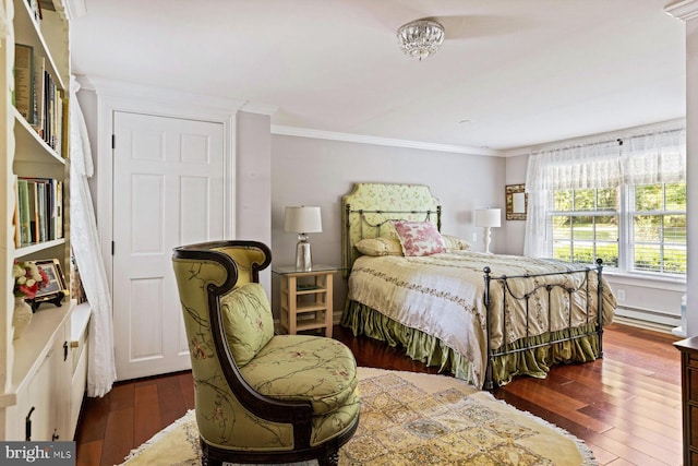 bedroom with crown molding, dark hardwood / wood-style flooring, and a baseboard radiator