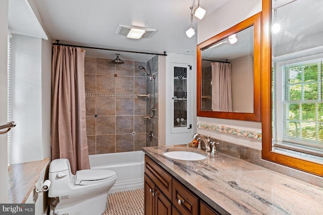 full bathroom featuring toilet, shower / tub combo with curtain, vanity, and tile patterned floors