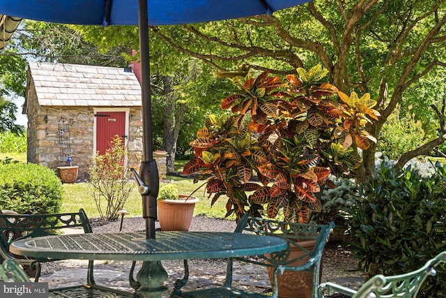 view of patio / terrace featuring a shed