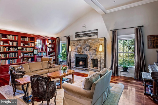 living room featuring lofted ceiling, crown molding, a fireplace, and wood-type flooring