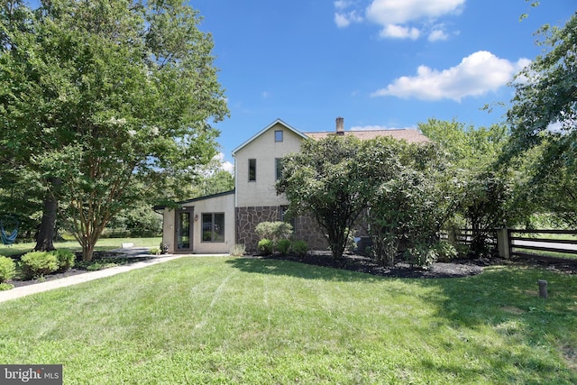 view of front of property with a front lawn