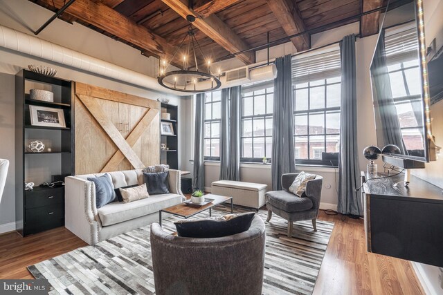 living room featuring an inviting chandelier, hardwood / wood-style flooring, beamed ceiling, and wooden ceiling