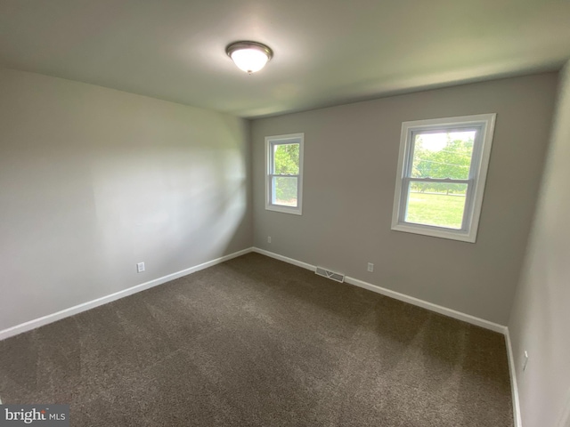 empty room featuring carpet flooring